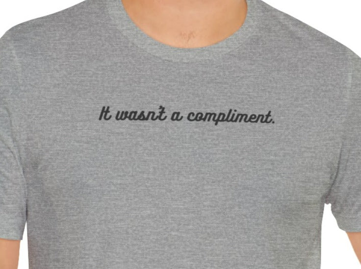 It Wasn't a Compliment Unisex Jersey Short Sleeve Tee.